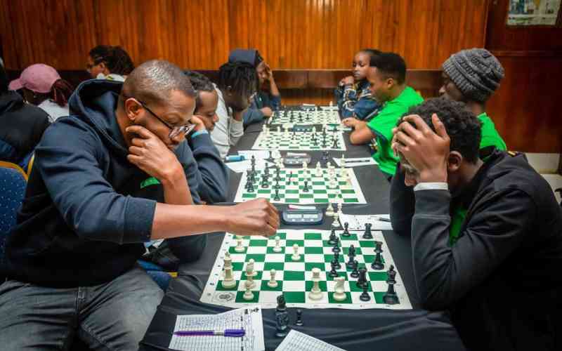 Photo of someone working poolside at a resort